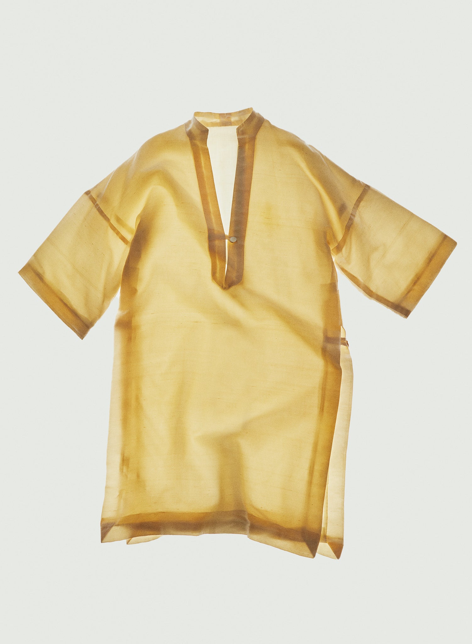 Vintage essential yellow tunic on white background